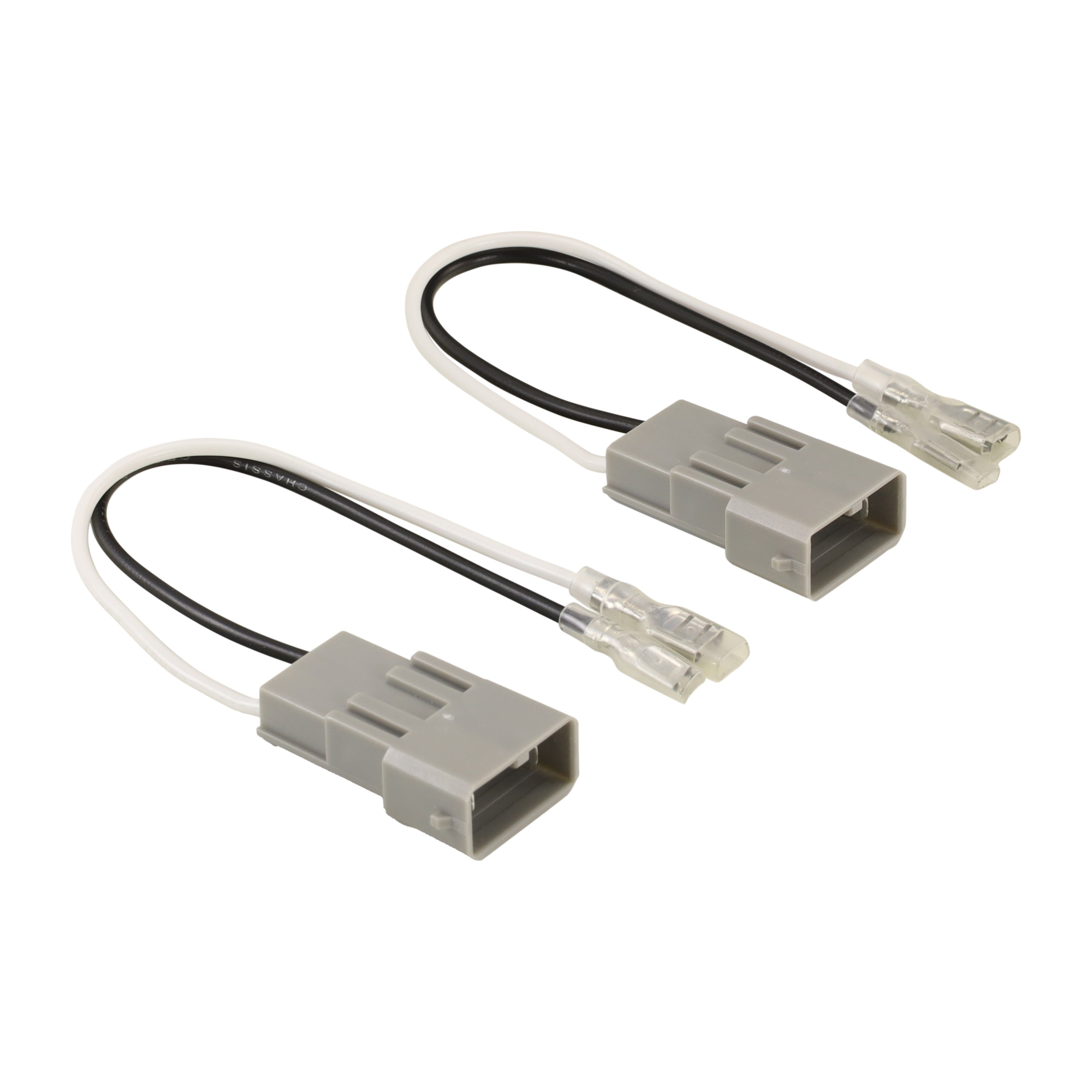 Grey factory speaker plugs with black and white wires ending in spade terminals