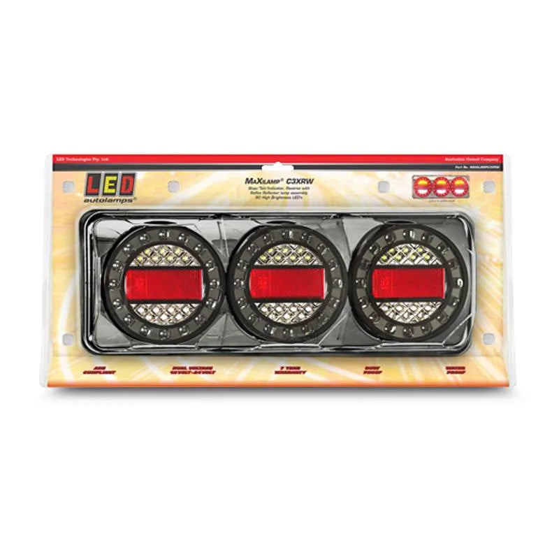 Three LED Autolamps MAXILAMPC3XRW stop/tail/indicator lights with black chrome housing, packaged in a box with a clear plastic window displaying the product.