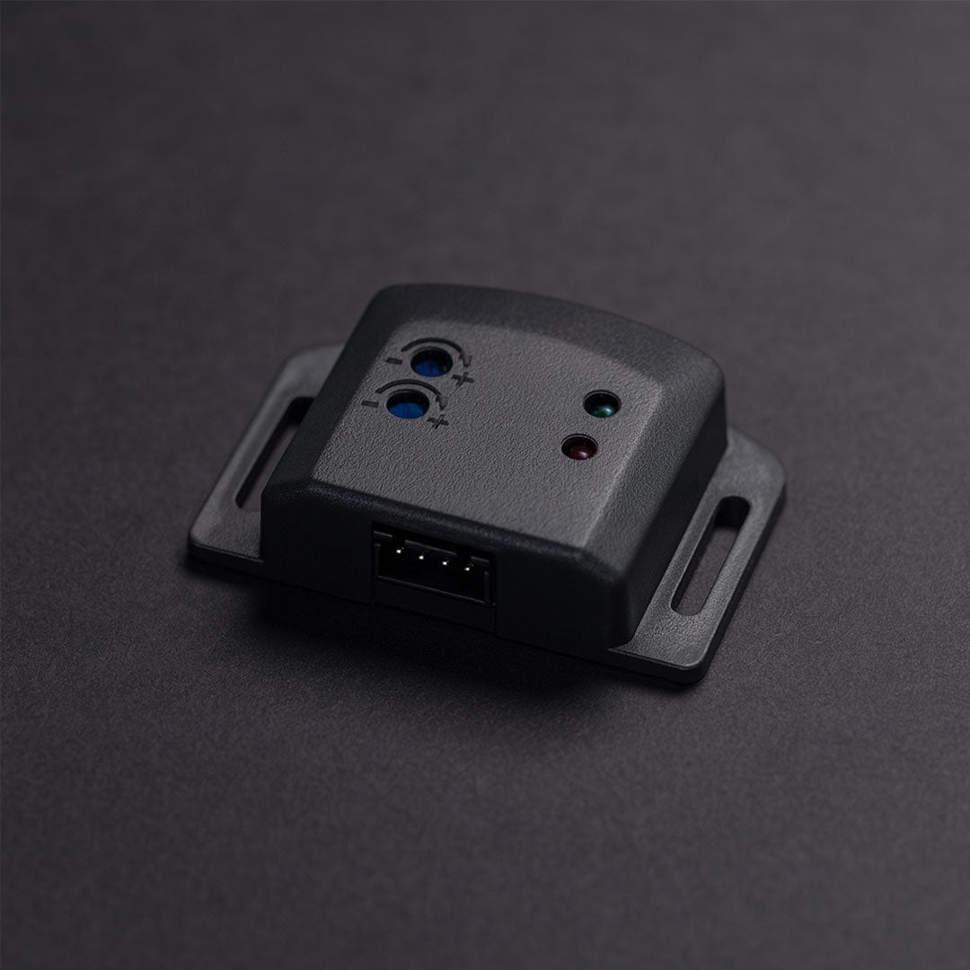 Black electronic device with ports on a dark gray background