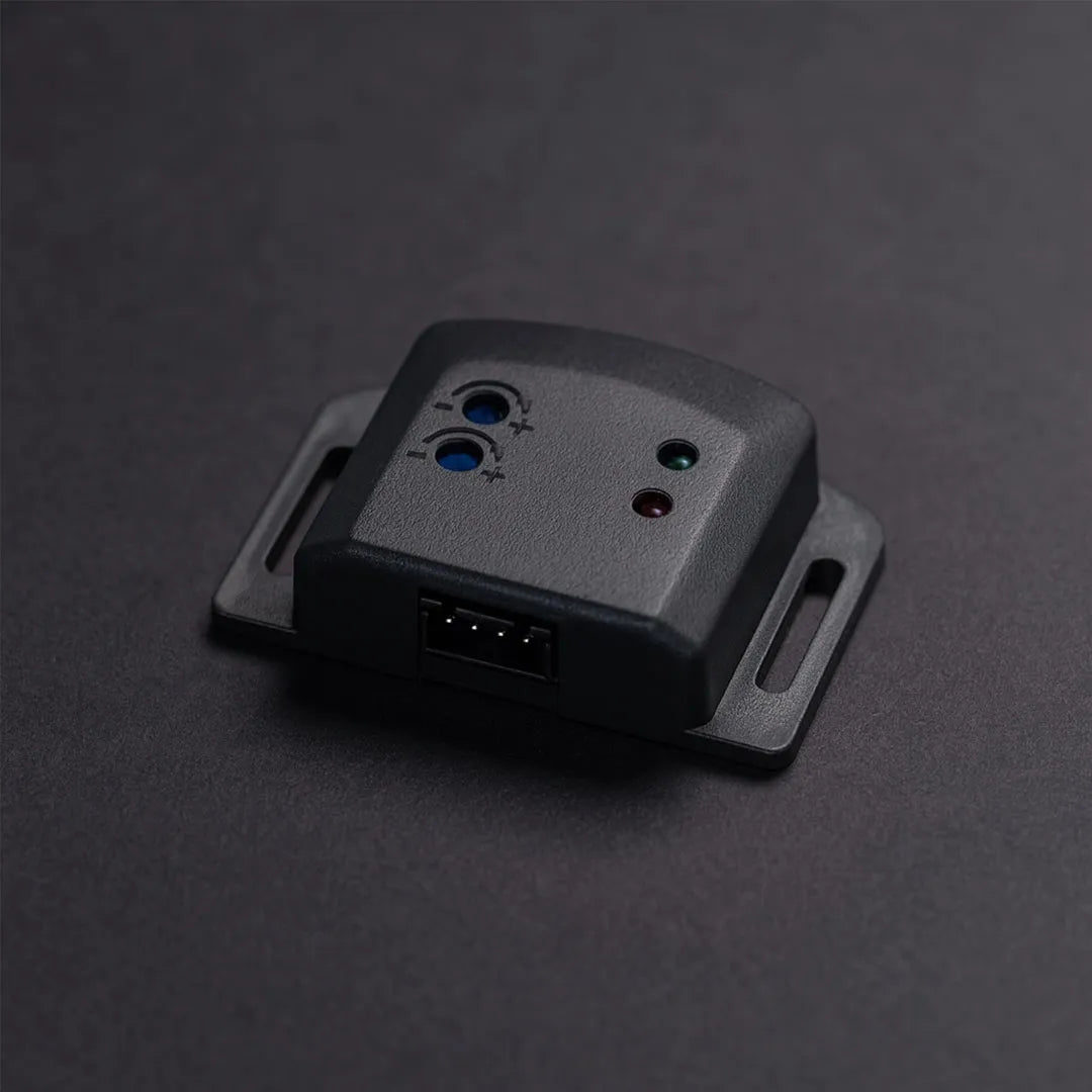 Black electronic device with ports on a dark gray background