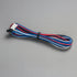 Colorful wire cable with connectors on a gray background