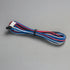 Colorful wire cable with connectors on a gray background