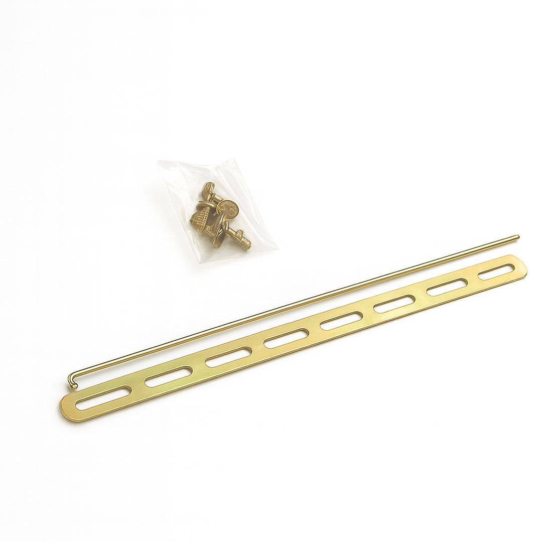 Gold metal rod with small components on a white background