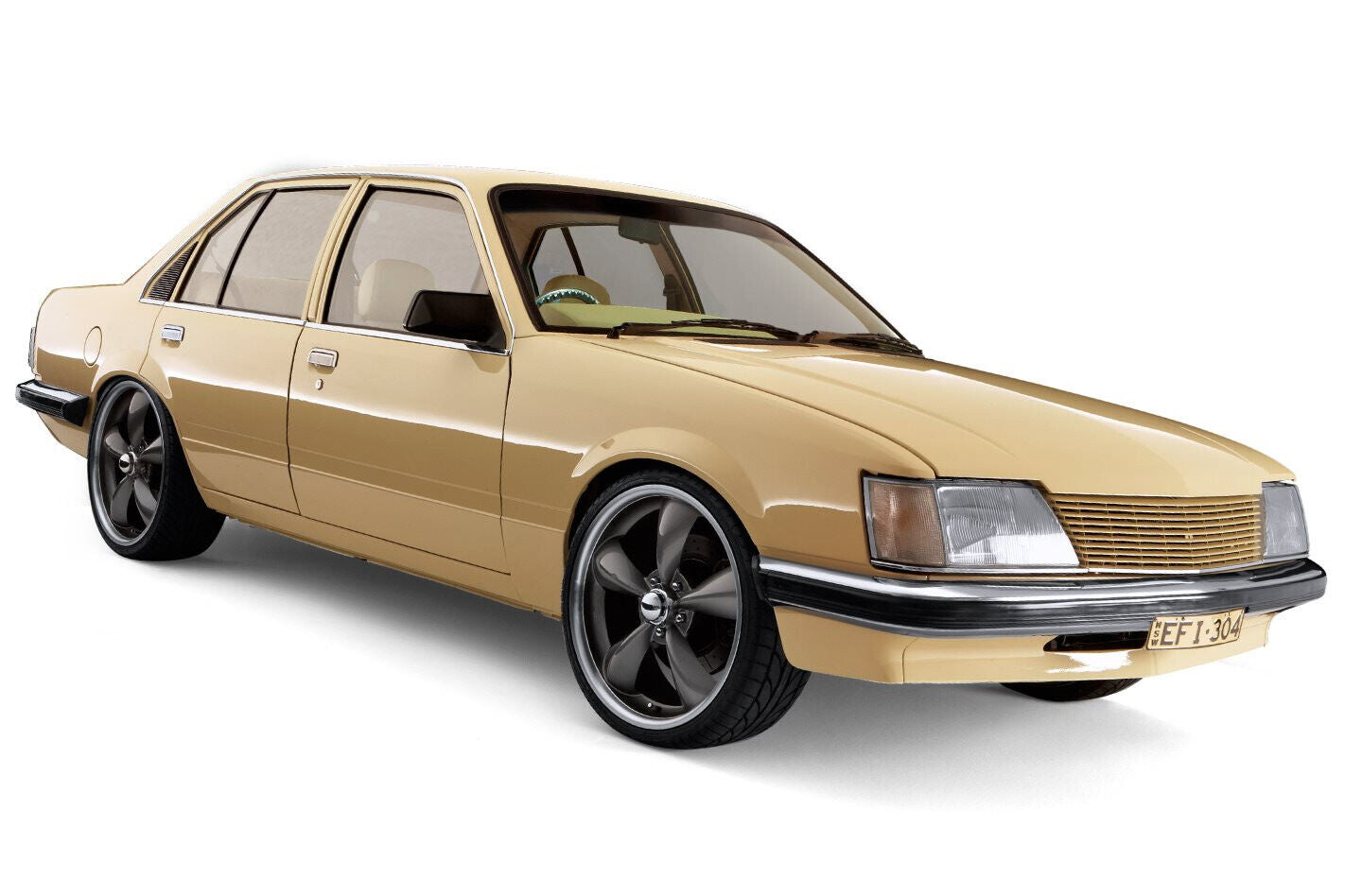 Gold Holden Commodore sedan from the VB to VK era