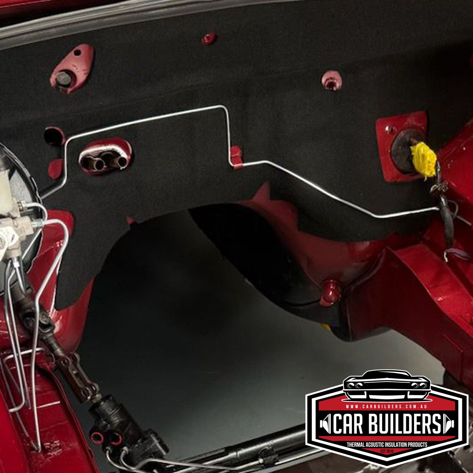 Close up of the fitted Commodore firewall pad around the brake lines and wiring