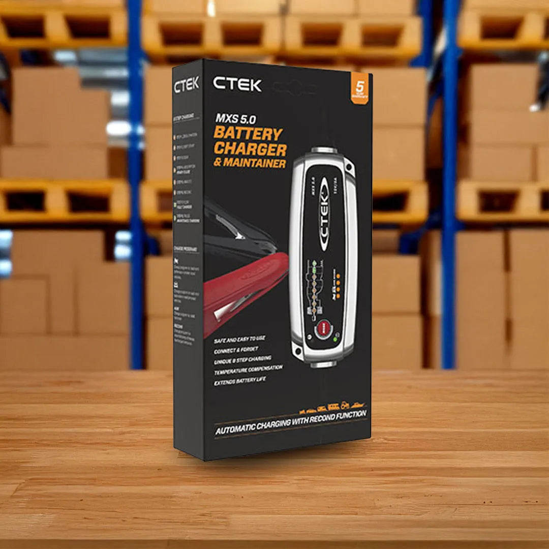 Front view of CTEK MXS 5.0 12V 5A battery charger with digital display and cables box