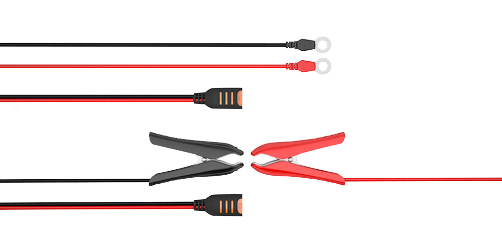 Set of black and red alligator clips on a white background