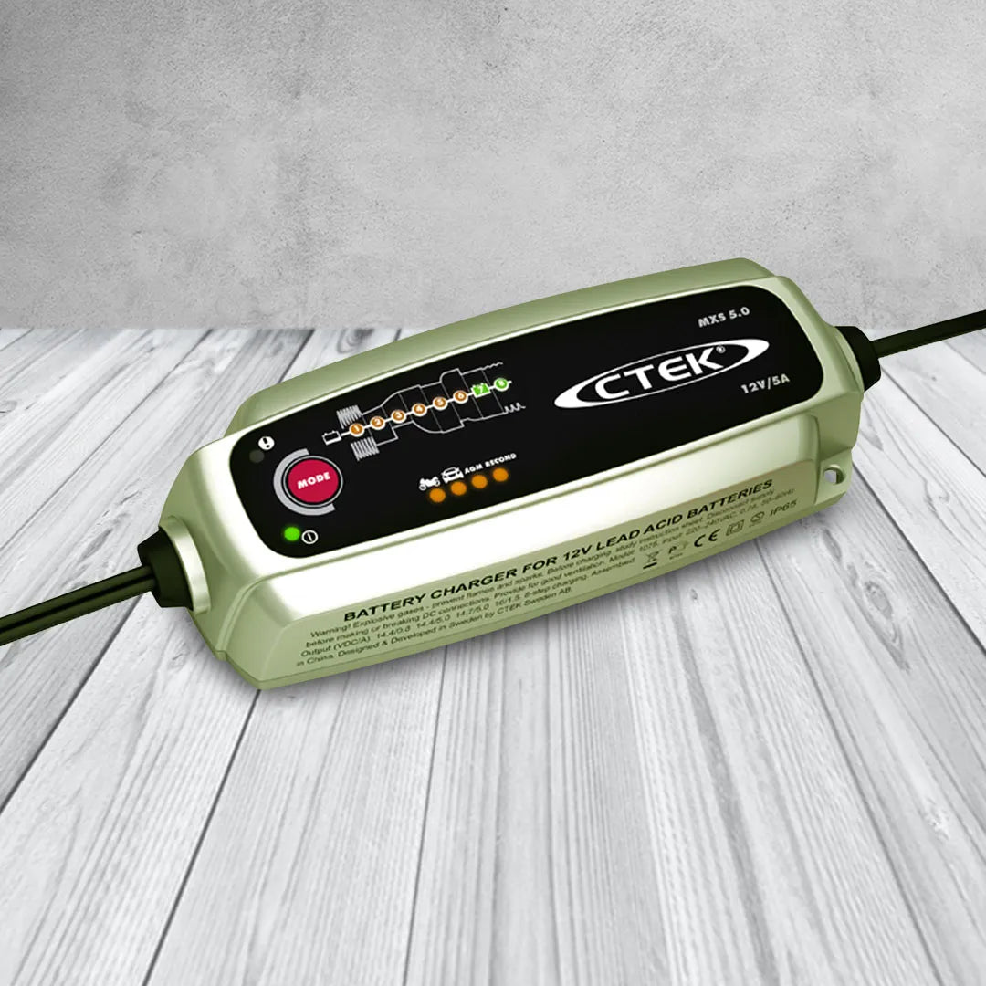 CTEK MXS 5.0 12V 5A battery charger with green casing, digital display and connected cables