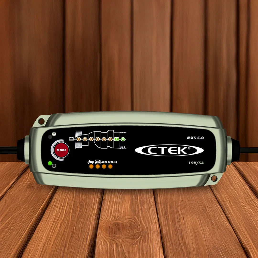 Front view of CTEK MXS 5.0 12V 5A battery charger with digital display and cables