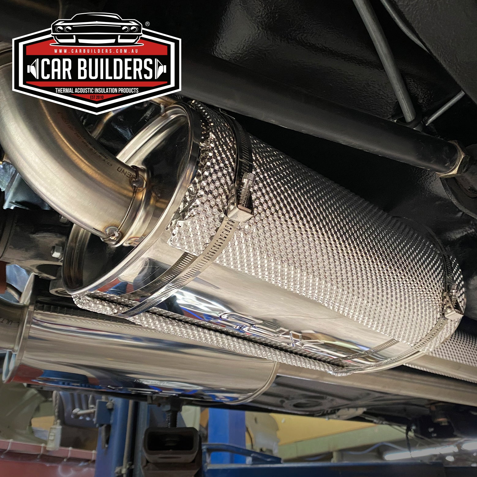 Direct To Heat Muffler Shield clamped onto an exhaust muffler under a vehicle