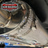 Close view of the dimpled aluminium muffler shield and hose clamps fitted to a muffler