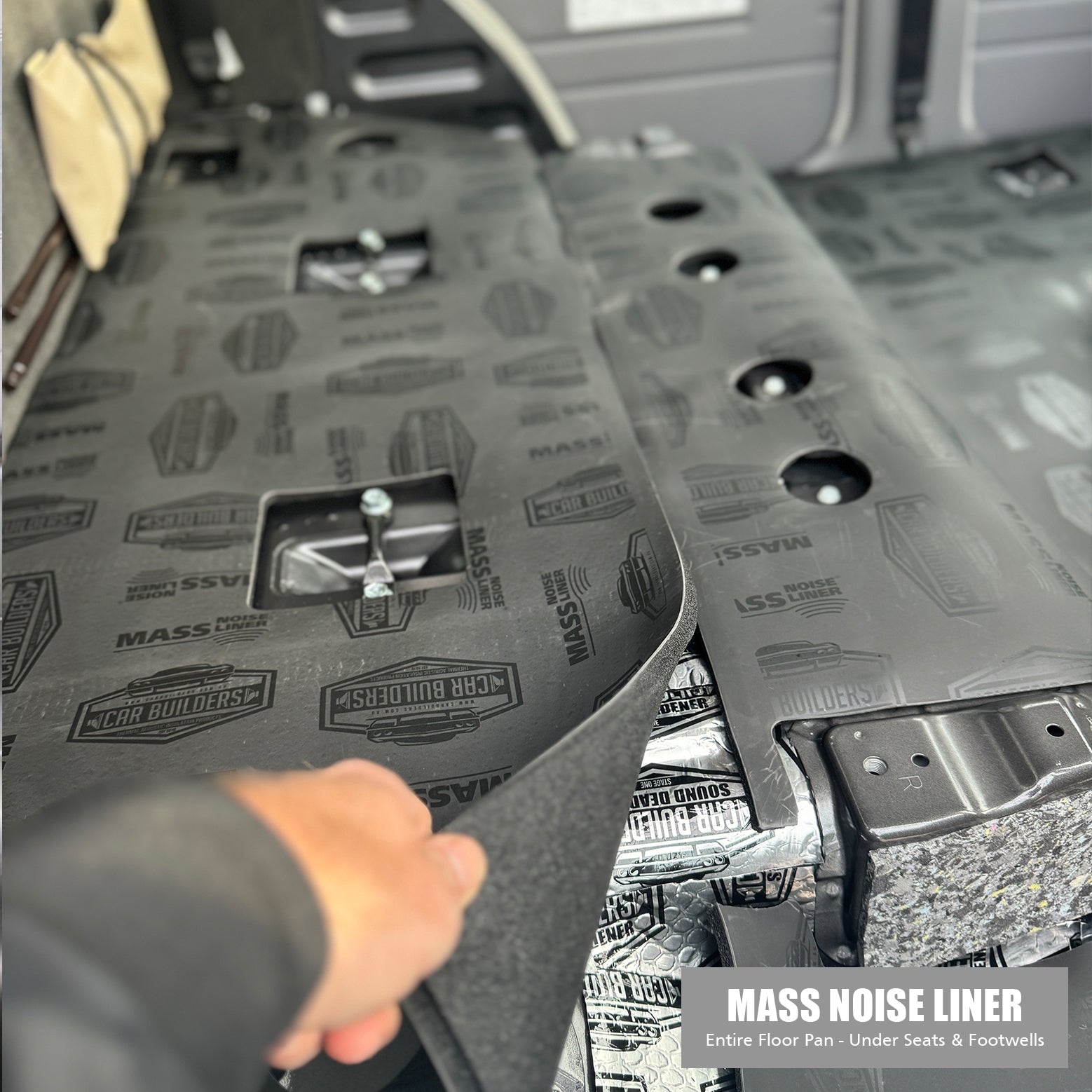 Grey Mass Noise Liner being rolled out over a deadened dual cab floor
