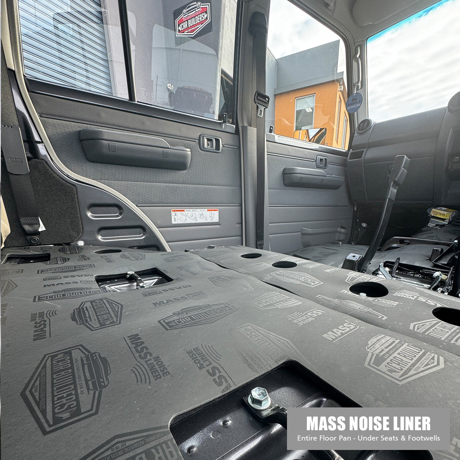Rear floor and rear seat base area of a dual cab covered with Mass Noise Liner