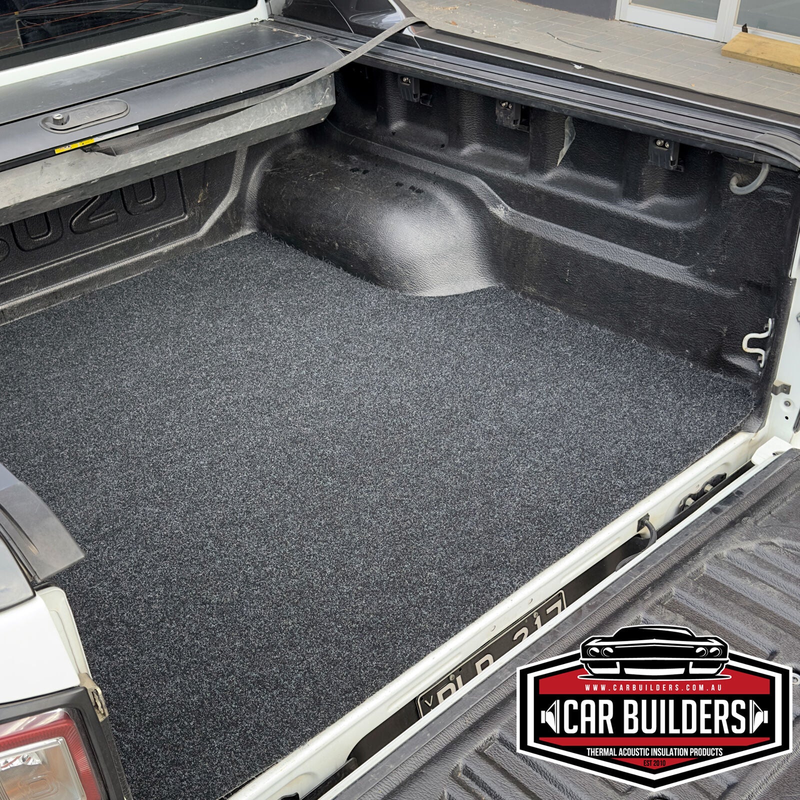 D-MAX cargo mat lying flat across the tub floor