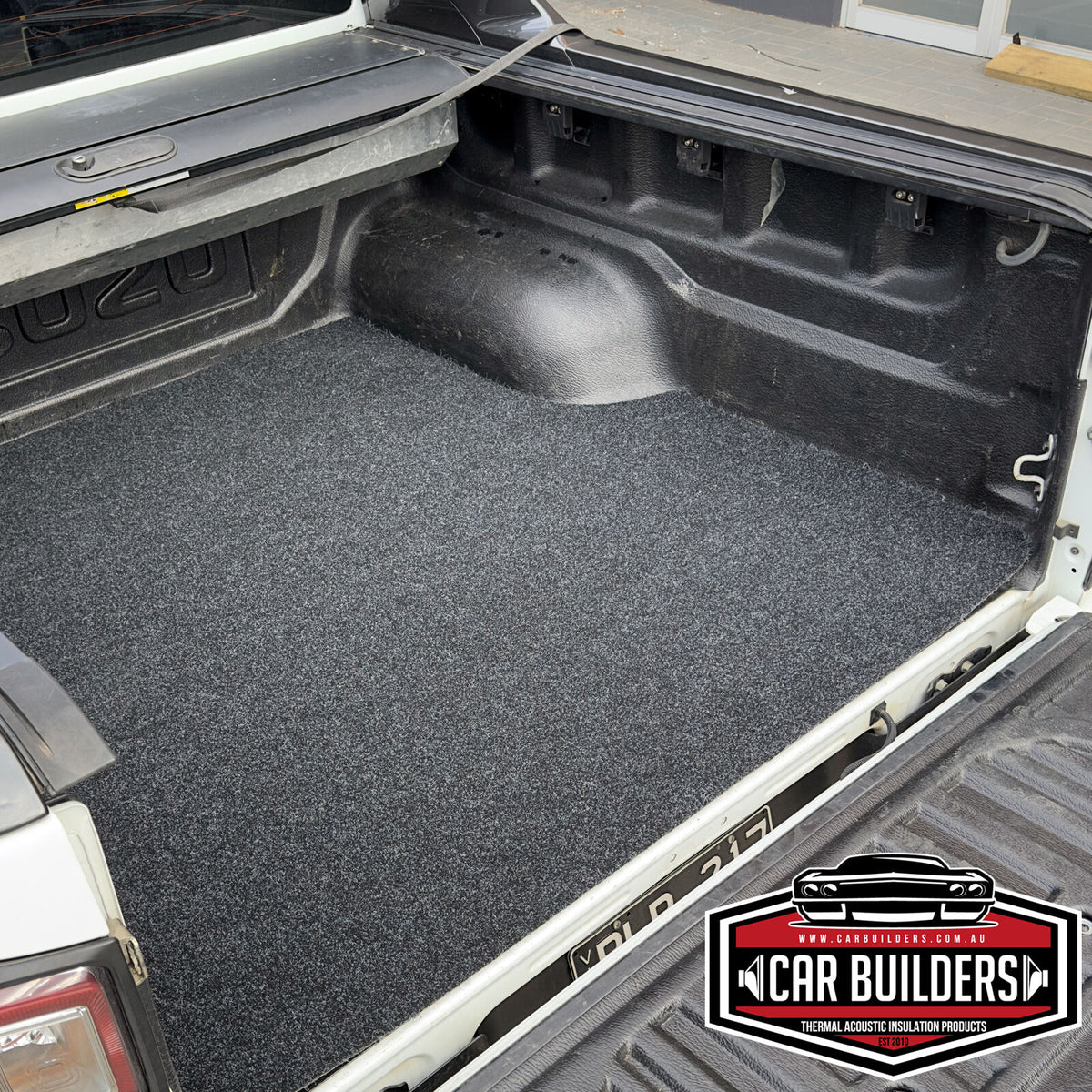 D-MAX cargo mat lying flat across the tub floor