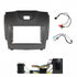 Vehicle installation kit for double DIN head unit including grey fascia panel, metal mounting brackets, wiring cables, and antenna adaptor.