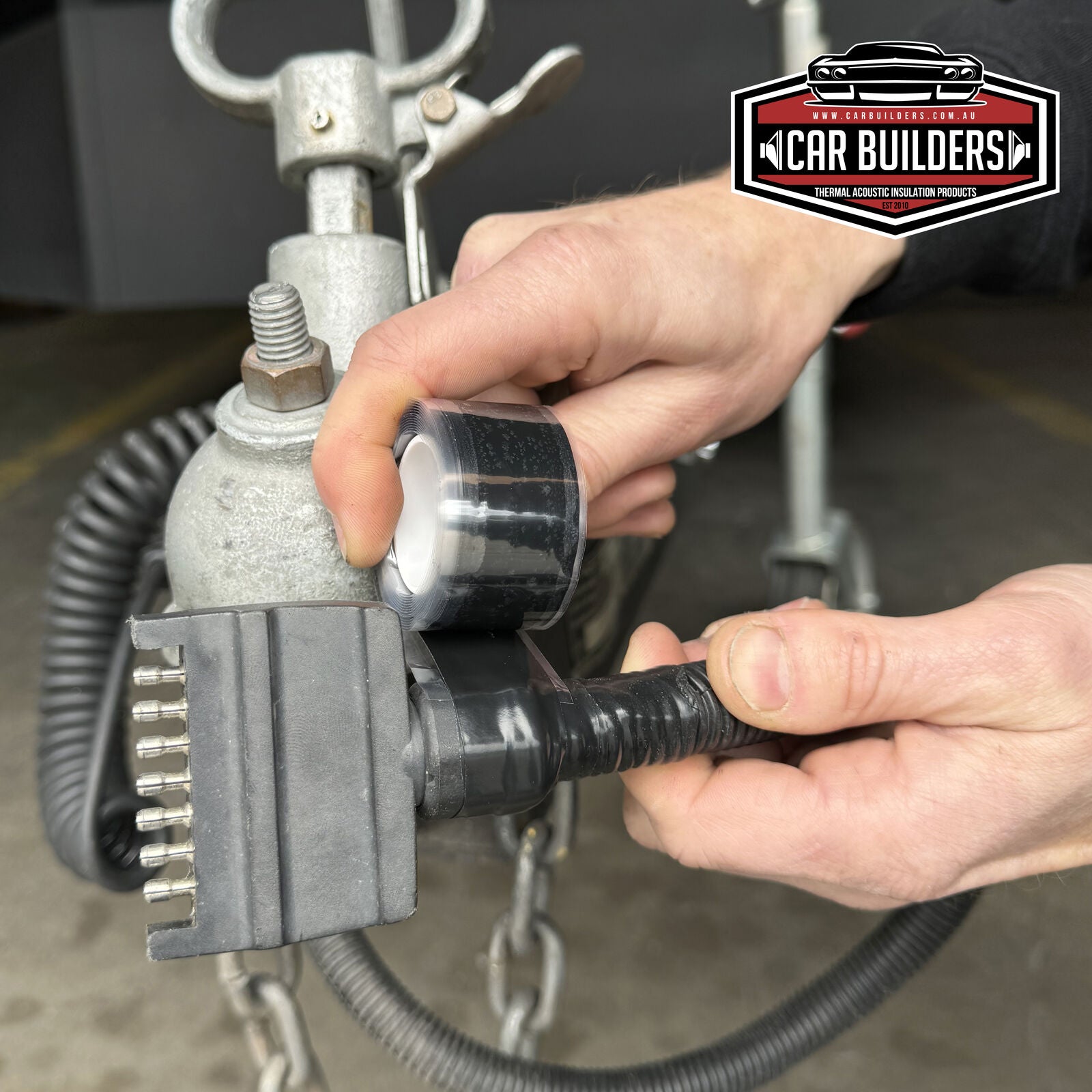 FUSE-IT tape sealing a trailer plug and its cable