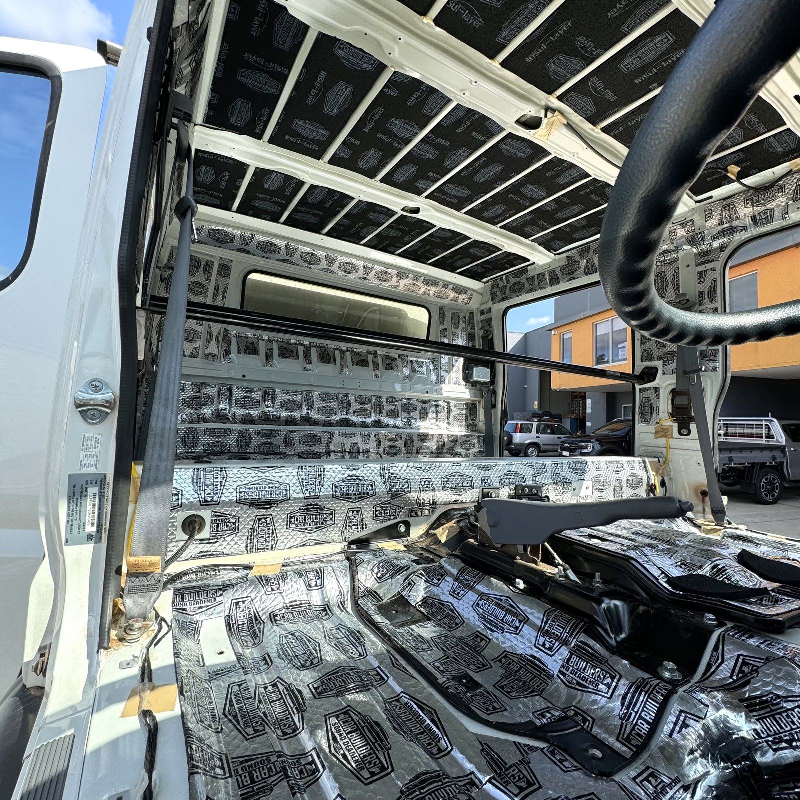 Canter cab stripped with tiles on the floor, walls and roof