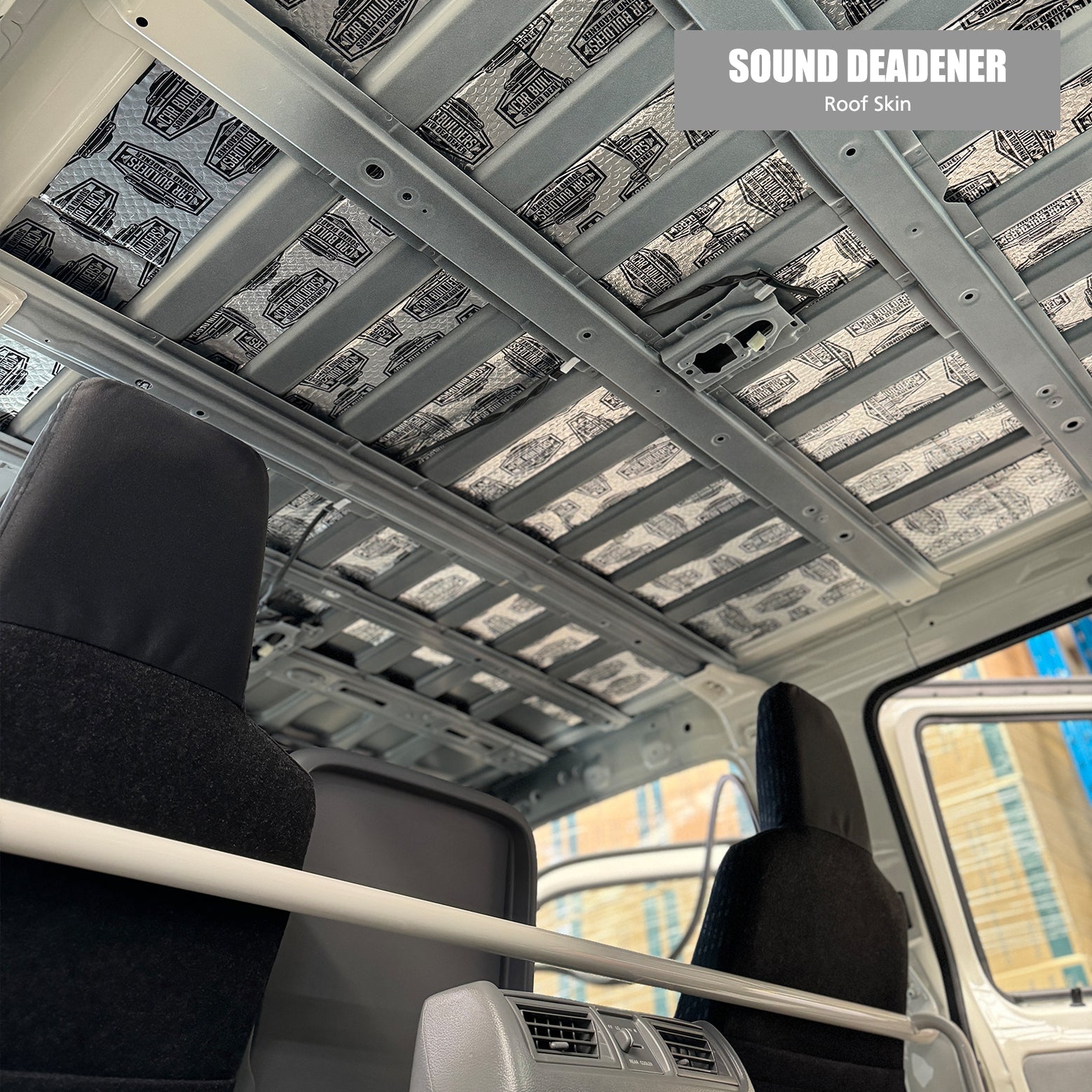 Deadener tiles laid on the Hino 300 roof skin