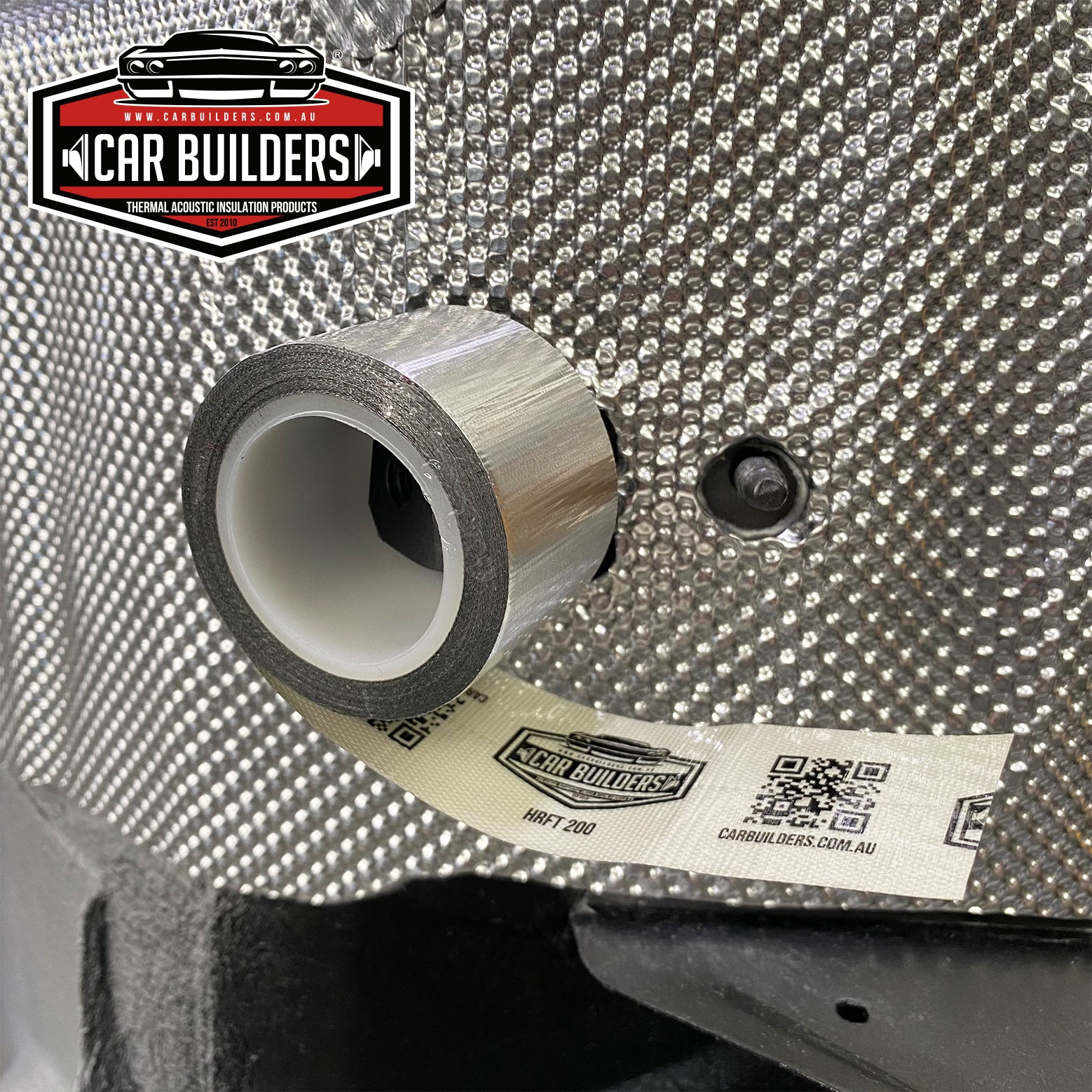 Foil tape roll sitting on an embossed heat shield panel