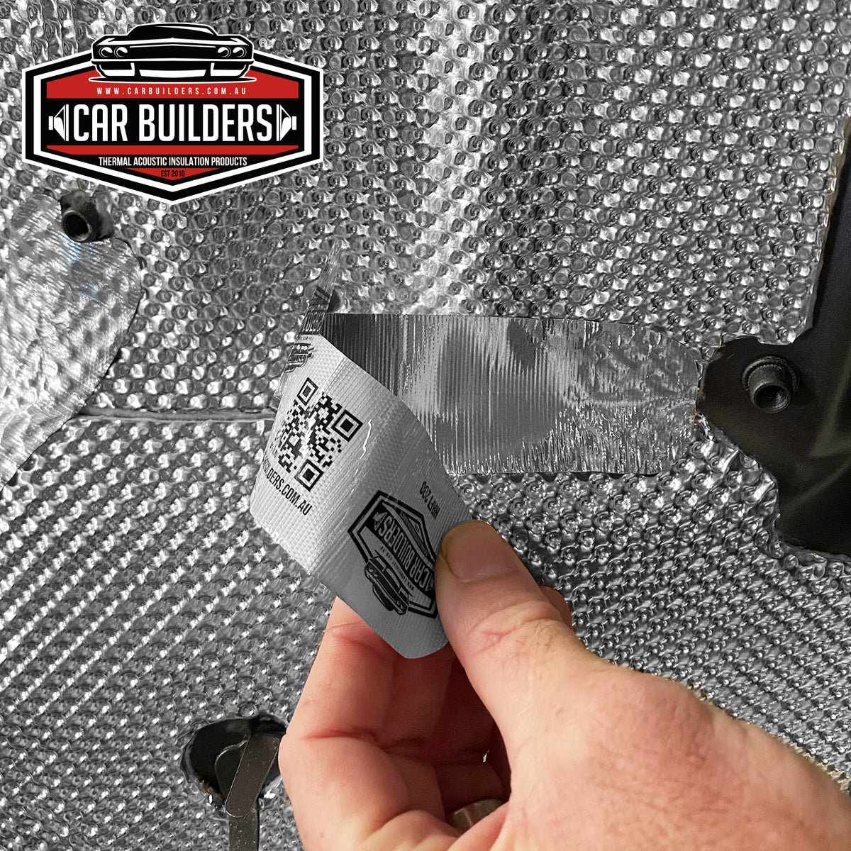Sealing the edge of an embossed heat shield with heat reflective foil tape