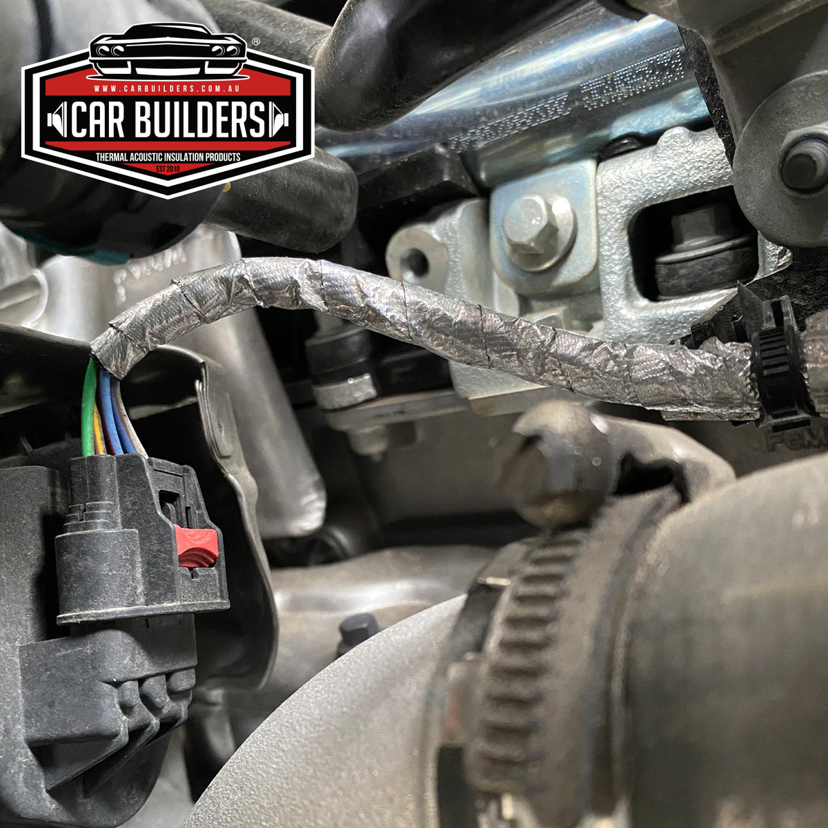 Engine bay loom and hoses protected with heat reflective foil tape