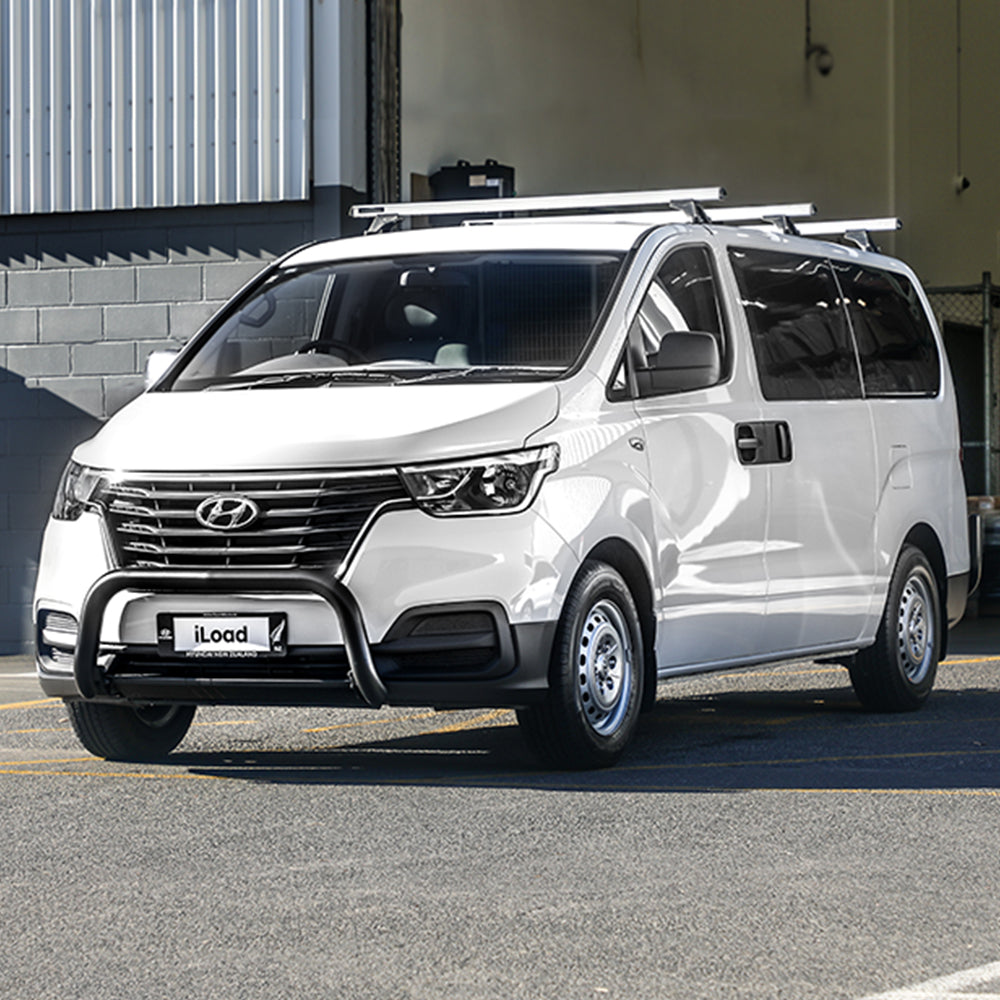 White Hyundai iLoad with roof racks and a bull bar