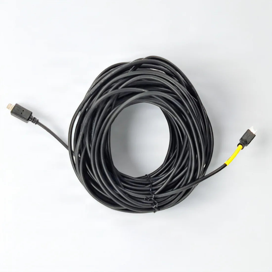 GNET 9m rear camera cable coiled on a light grey background, yellow sleeve near one plug