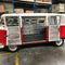 VW Kombi with its side doors open showing an insulated interior