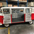 VW Kombi with its side doors open showing an insulated interior