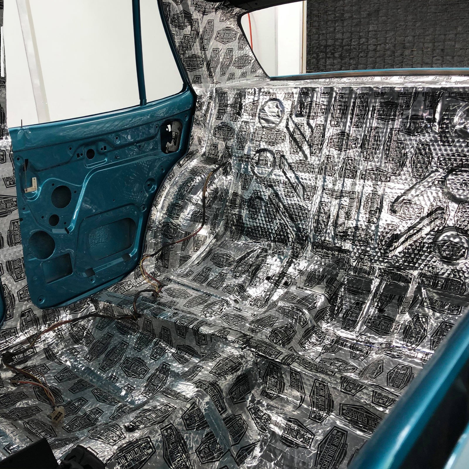 Stage 1 Sound Deadener sheets across a medium car floor pan