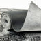 Roll of Car Builders Mass Loaded Vinyl showing the grained face and textile back