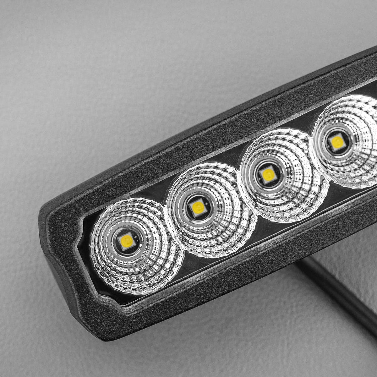 Close view of the lens showing the LED chips behind each reflector