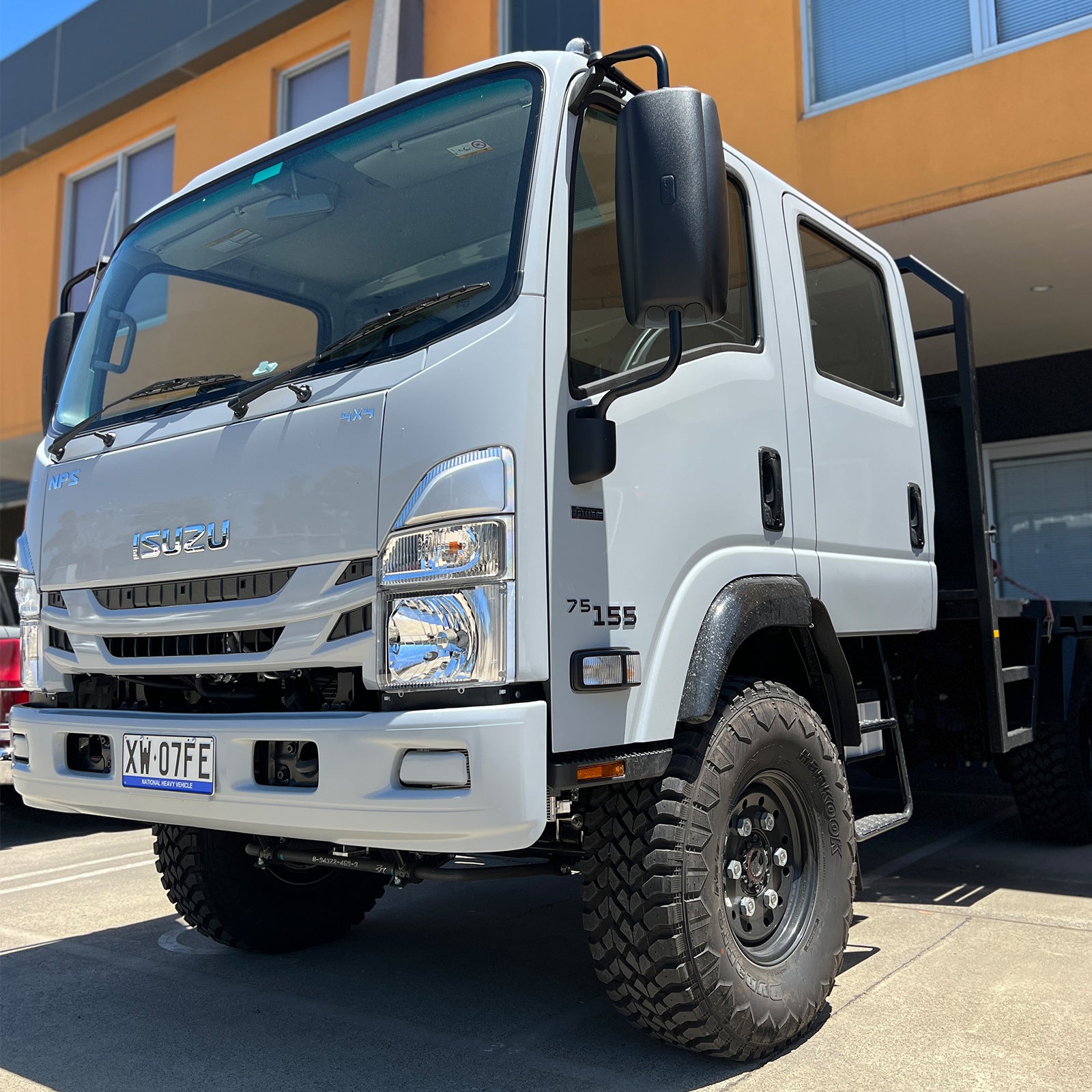White Isuzu NPS 300 dual cab truck