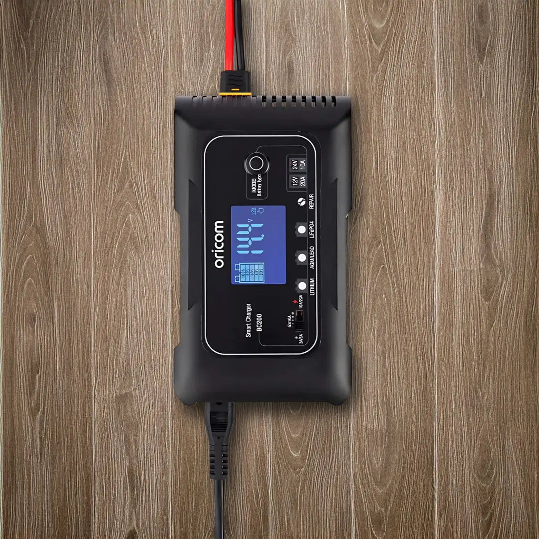 Oricom BC200 20amp charging unit equipped with a digital screen, user buttons, and ports for battery connection.