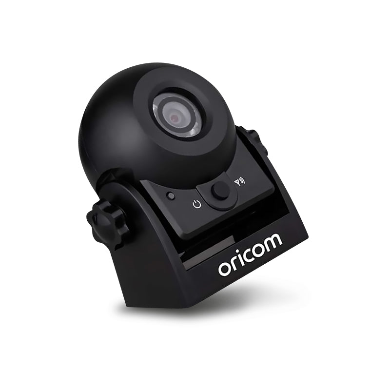 Tilted side-up view of Oricom WRC001 wireless reversing camera showing magnetic base, front control buttons, and durable black housing design.