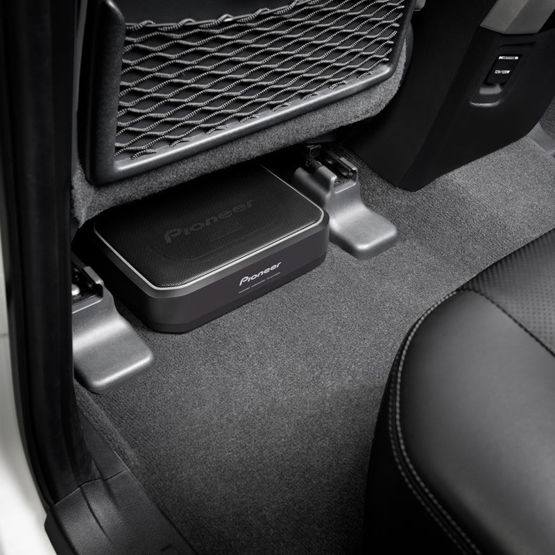 Pioneer TS-WX140DA 8" Space-Saving Amplified Compact Active Subwoofer showing below the car seat and more space efficiency 