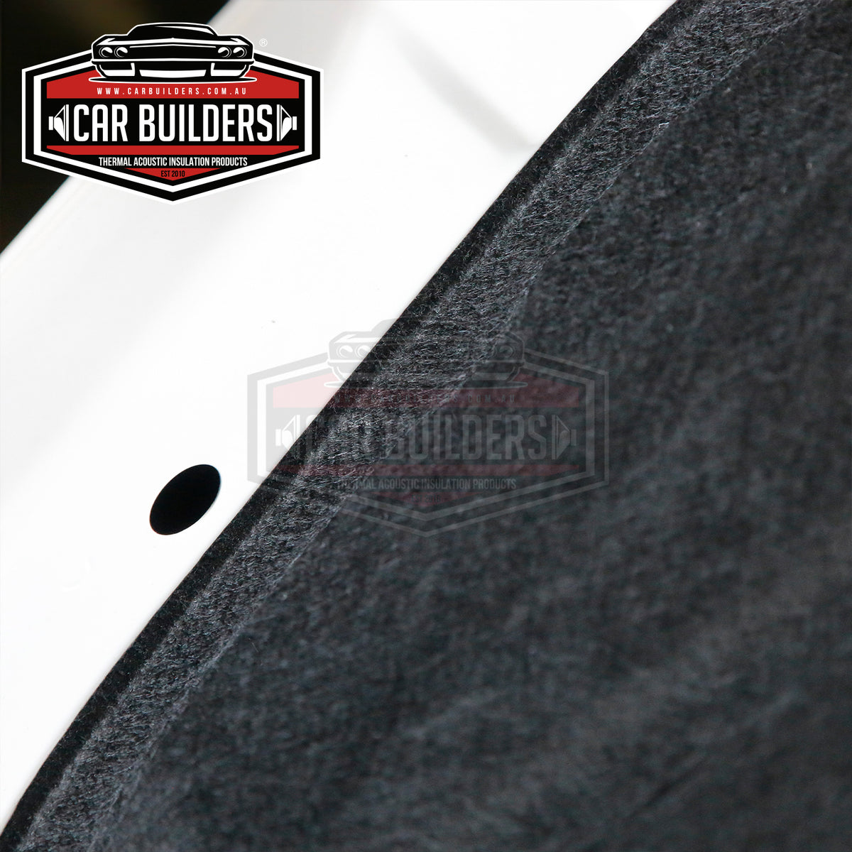 Close up of black under bonnet insulation fitted to a white bonnet