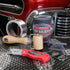 Application roller, foil tape and utility knife on sound deadener sheets