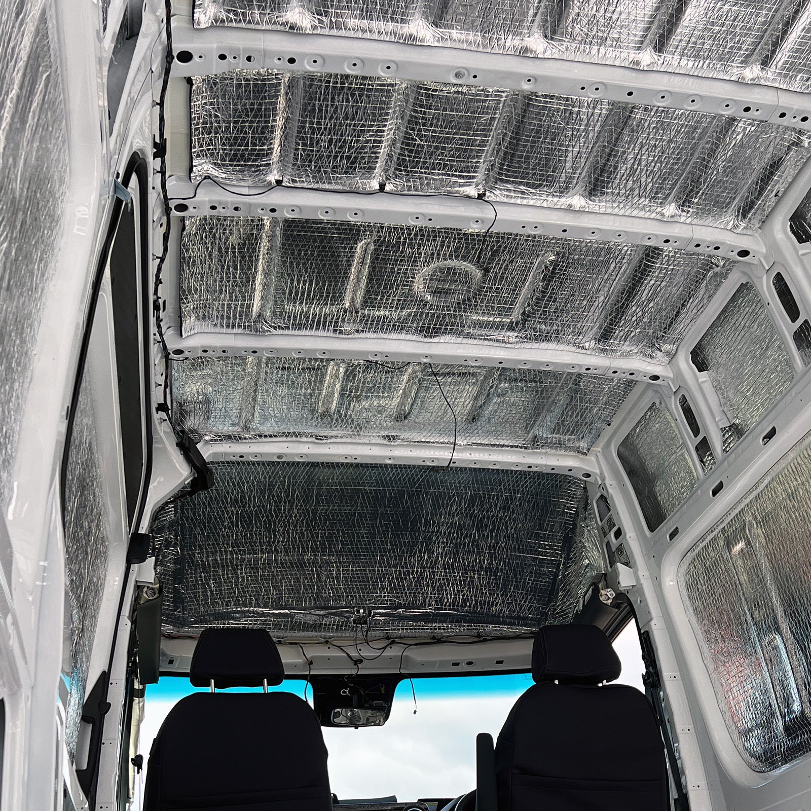 Sprinter roof lined with Van Liner, looking forward to the cab