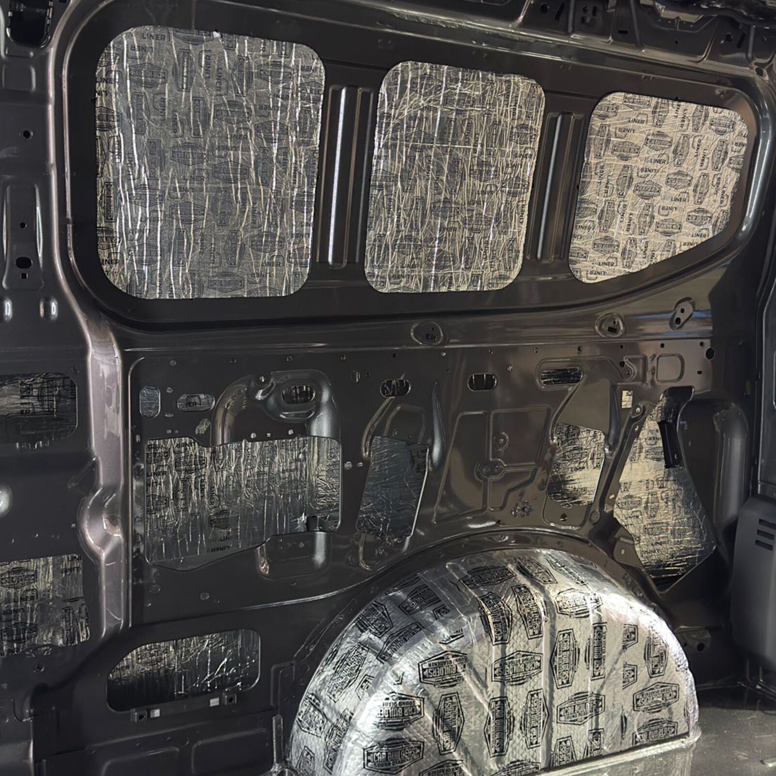 Stage 1 deadener on the Transit Custom side wall panels and wheel arch