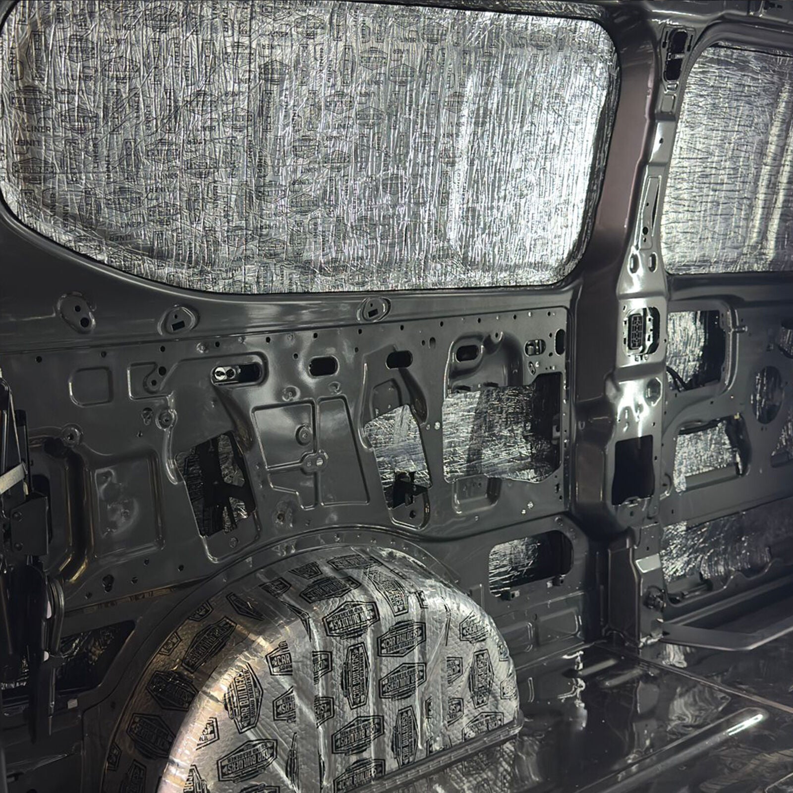 Transit Custom side wall with deadener on the large flat panels