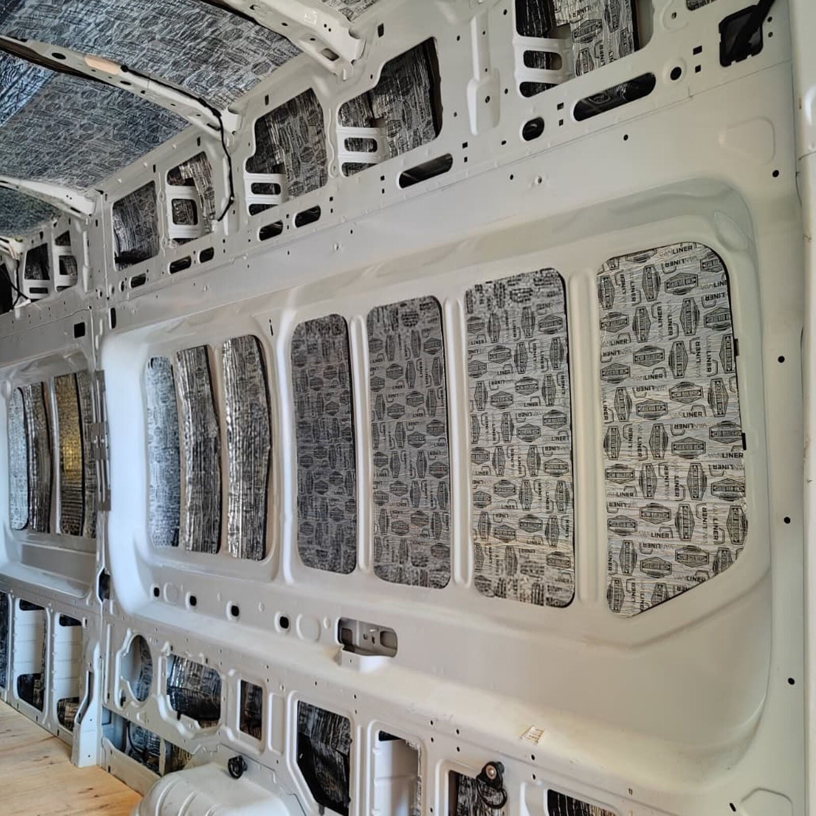 Transit Van side wall with Stage 1 deadener on the flat panels