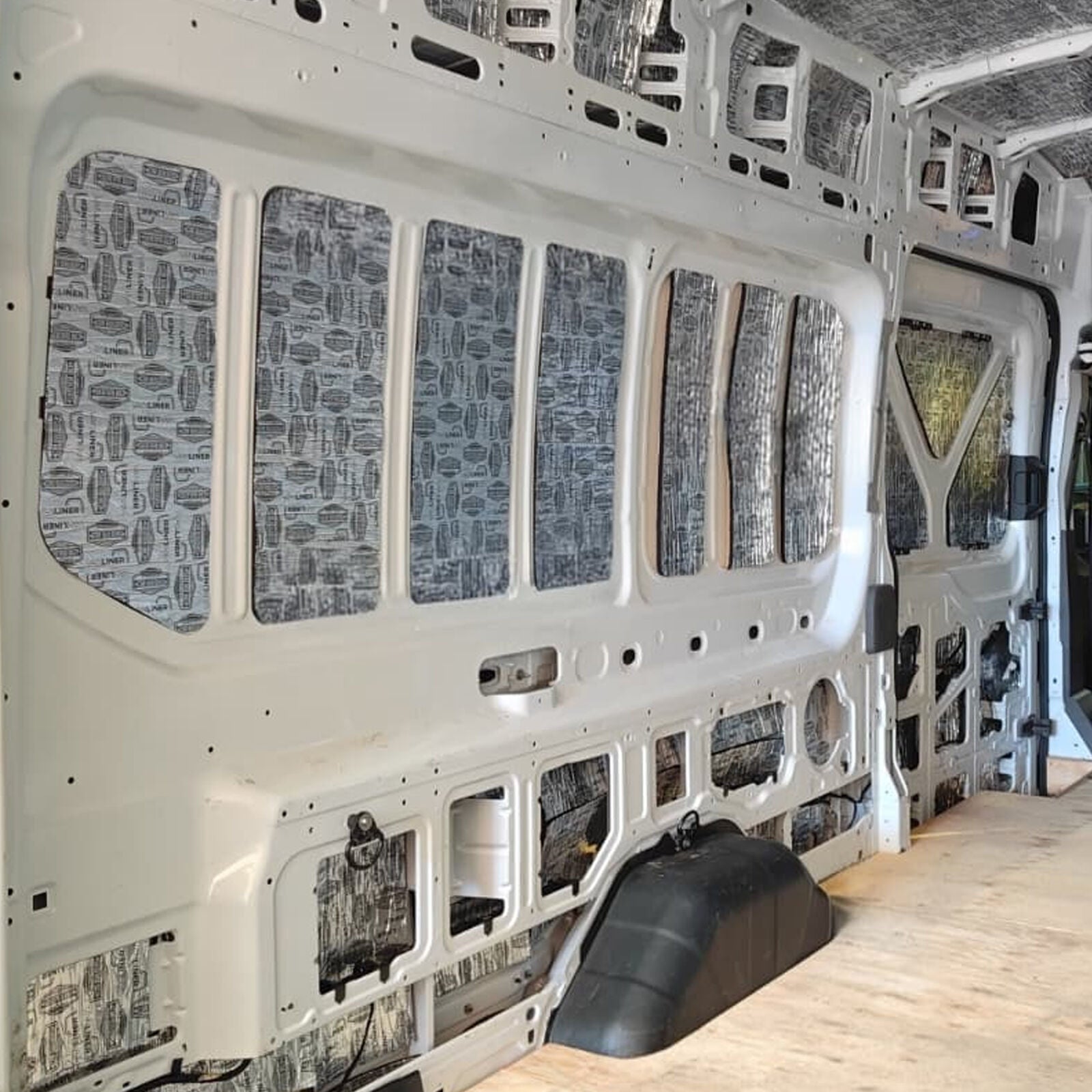 Transit Van cargo wall with deadener on each flat panel
