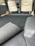 Corner lifted to show the rubber backing on the Troopy mat