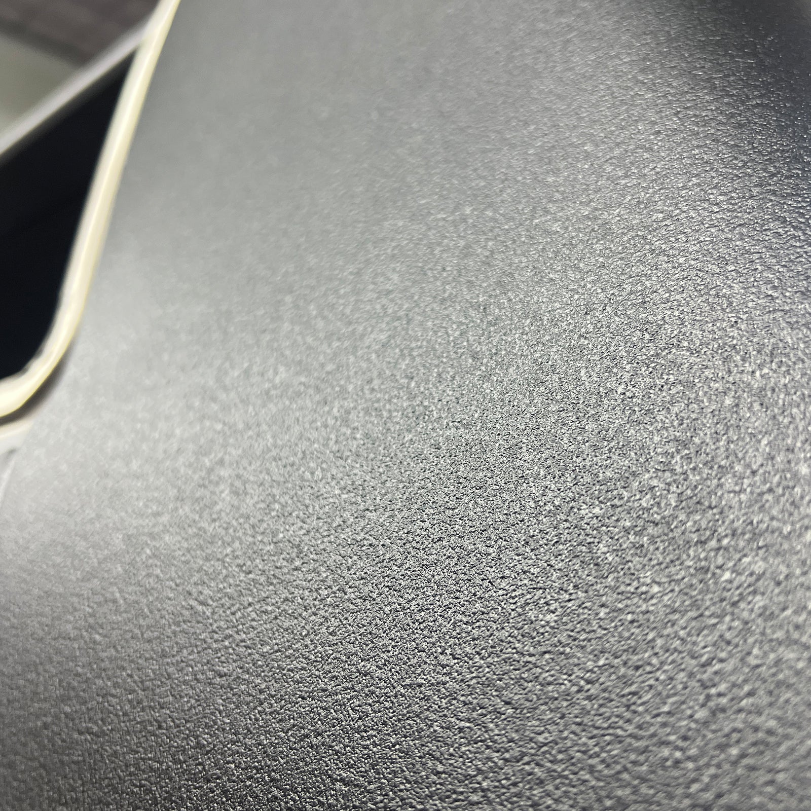 Close up of the black texture finish from TXT 1K