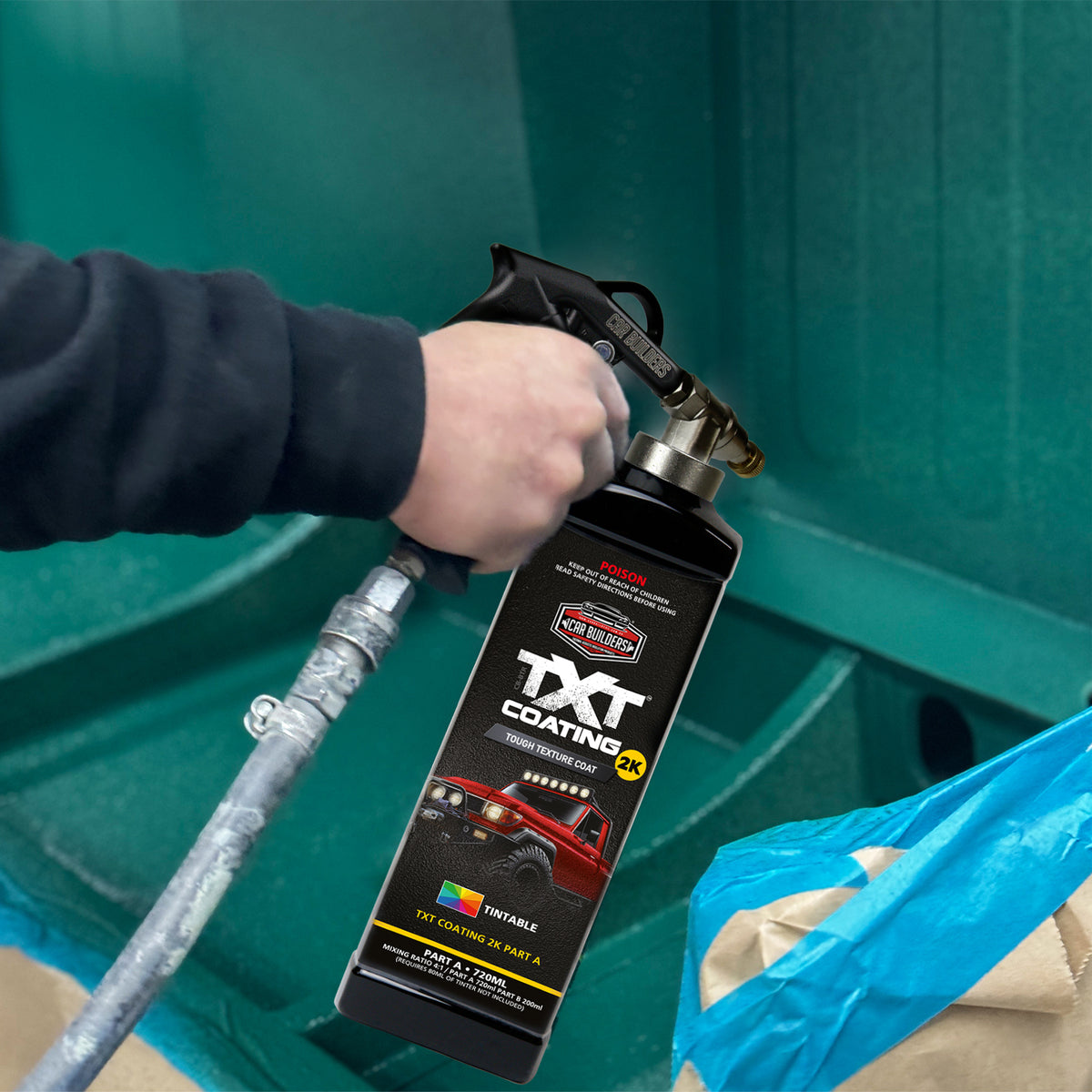 Spraying teal tinted TXT 2K onto a panel