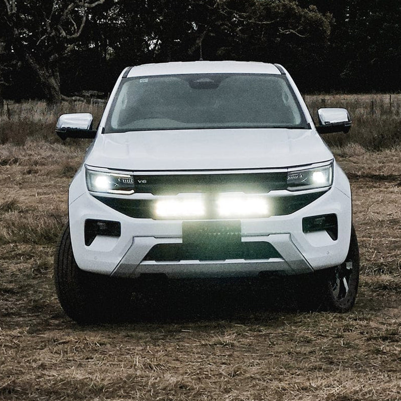 Complete LED behind-grille light bar set for VW Amarok, including long and short black LED bars designed for hidden front-end mounting. installed to the car 