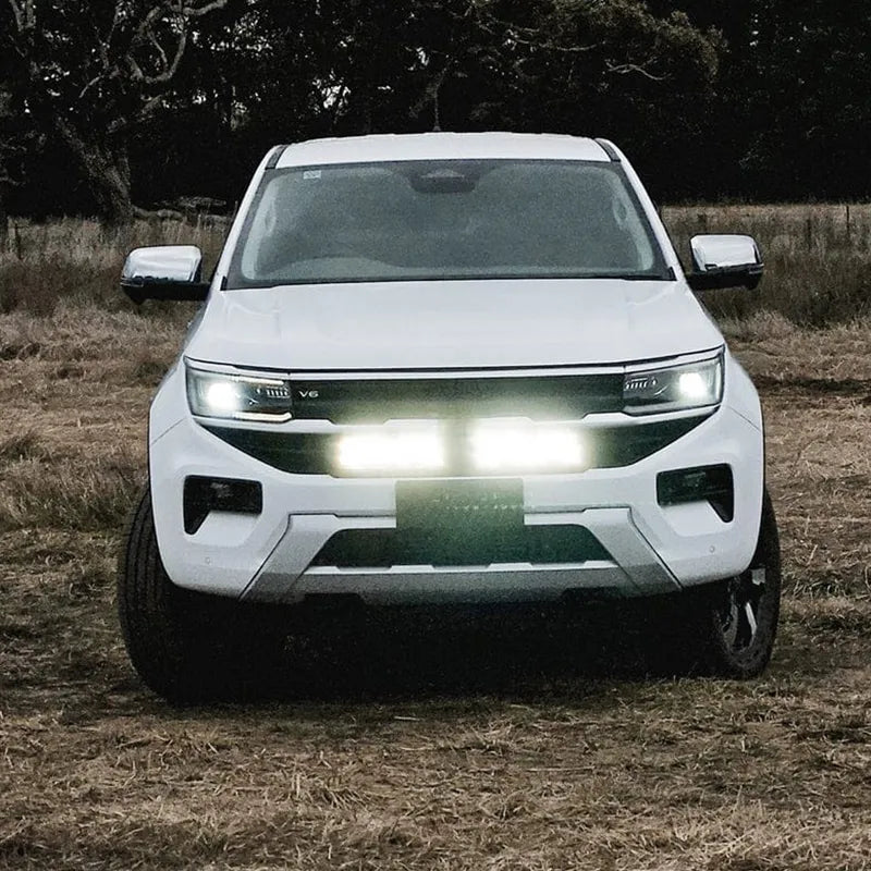 Complete LED behind-grille light bar set for VW Amarok, including long and short black LED bars designed for hidden front-end mounting. installed to the car 